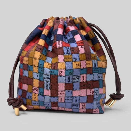 Prettysac Hermes Paris silk blend drawstring pouch with patchwork of equestrian motifs and stamps in earthy tones and pastels.