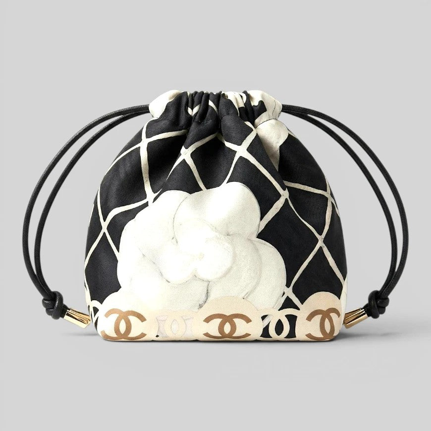 Prettysac black and white camellia print drawstring pouch with gold accents and cord closure.