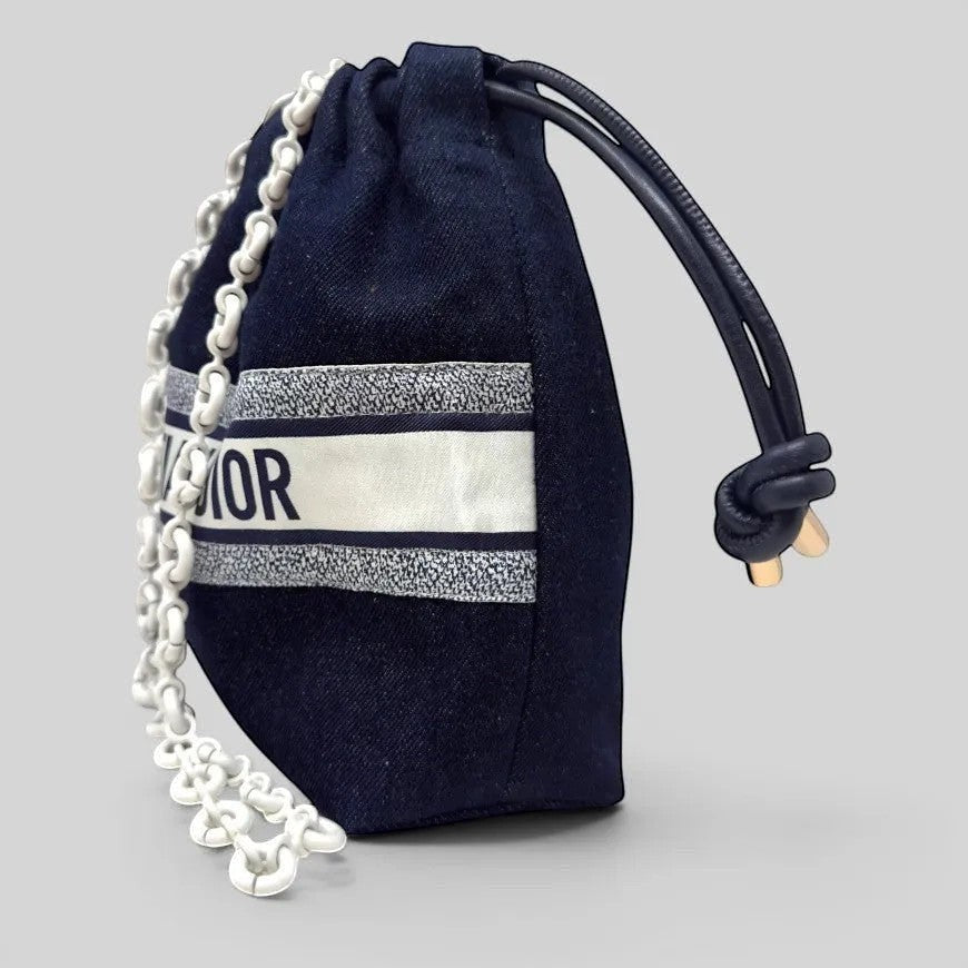 Prettysac Christian Dior dark wash denim drawstring pouch with white logo band and chunky chain strap.